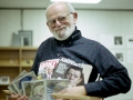 Irwin Mayer, 1st Librarian, with Magazines and CDs