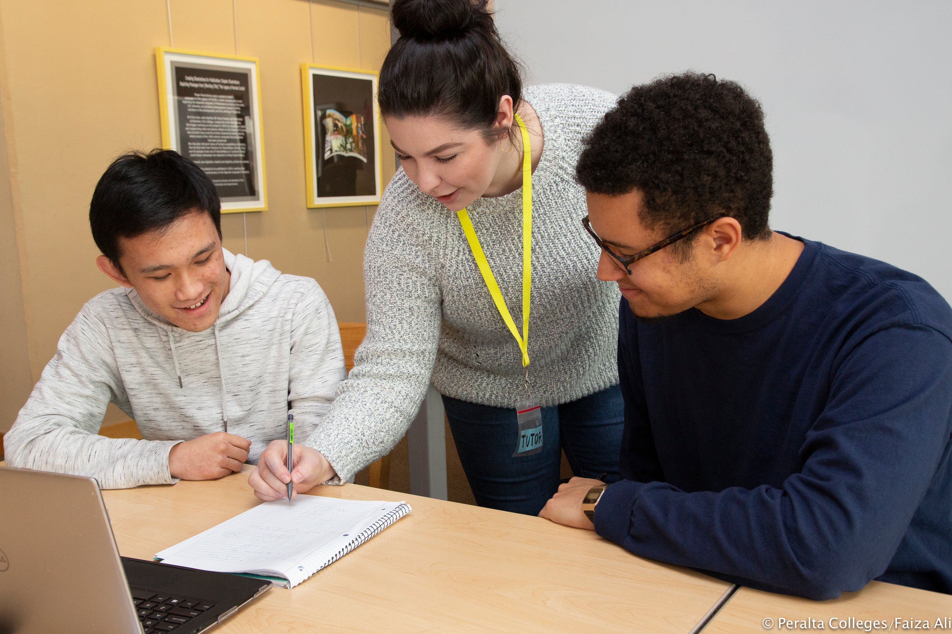 two students being tutored by an instructor