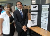 Arsalon Gawhary, Umoja participant, presents financial analyst poster with Karen Shields, BCC staff